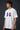 Model wearing white POPCASE Fernando Alonso oversized t shirt with navy blue crackled Have To Win 14 design and Alonso signature