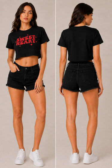 Model wearing a white "Sweet Heart" graphic oversized croptop t-shirt with red distressed lettering and star accents. Streetwear fashion. - black