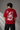 CHAL brand red oversized t-shirt with white graphic print of dice and text. Model wearing the t-shirt to showcase the relaxed, oversized fit.