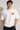 Man wearing a white t-shirt with 'BRAND STATE' in red text against a gray background