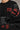 Black t-shirt with red text and fabric details displayed