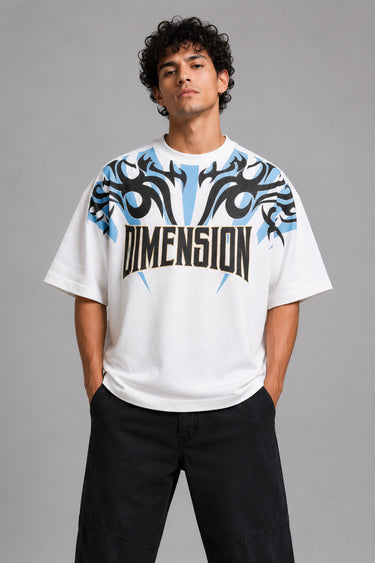 Model wearing a white DIMENSION oversized t-shirt with a black and blue graphic print and a silver chain necklace. - white