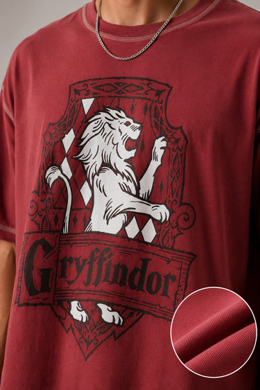 Red Thread & Co. oversized t-shirt featuring a detailed Gryffindor crest graphic with a lion, designed for a trendy streetwear look.