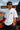 Model wearing white POPCASE Lewis Hamilton Ferrari oversized t shirt with Scuderia shield on chest and Lewis Hamilton Ferrari car back graphic