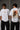 Black MIGHTY ARJUN oversized t-shirt featuring distressed Hindi script graphic in beige and orange, highlighting streetwear style. - white