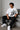 POP-MOUNTAIN-CLIMBER oversized t-shirt in white, featuring a striking black and white graphic of a mountain climber. Designed for ultimate comfort and streetwear style.
