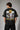 Model wearing an anthracite black Mbappe oversized t-shirt with gold "MBAPPE" graphic and signature, Real Madrid and number 7 logos on sleeves. - anthracite black