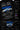 Black oversized t-shirt featuring a detailed white blueprint and a silver Nissan Skyline R34 with blue racing stripes graphic. Includes text 'The Nissan Skyline GTR'.