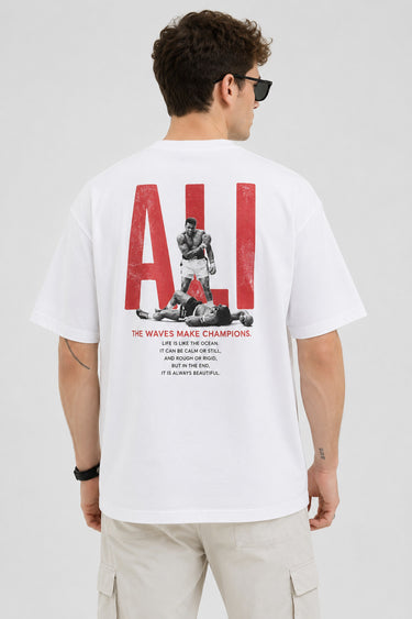 Man wearing a white ALI oversized t-shirt and beige cargo pants, sitting on grey stairs. He wears black sunglasses and jewelry. - white