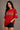 Woman wearing a red 'Friends' themed t-shirt with character illustrations on a plain background