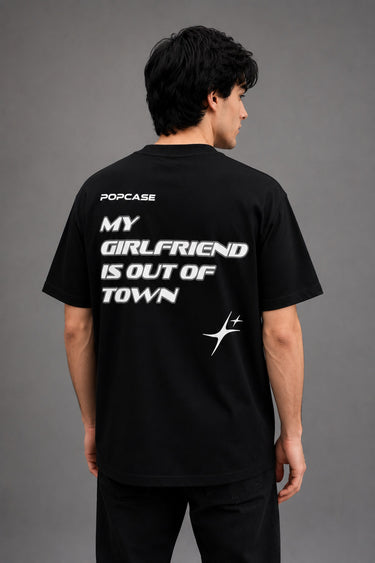 Black QUICKE oversized t-shirt featuring bold white graphic print on the chest and back. Showcasing premium fabric details and relaxed fit. - black