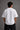 White oversized t-shirt featuring a striking black and blue graphic of Hanuman Dada, with a large blue halo. Designed for a relaxed, streetwear fit.