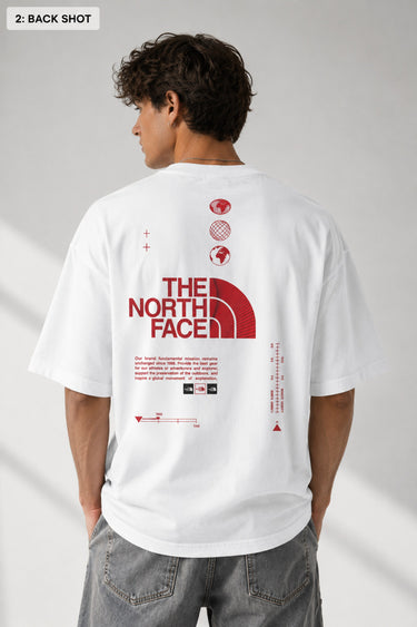 Model wearing a white POP-FROM-THE-NORTH oversized t-shirt with a small red logo on the chest, styled with black cargo pants, showcasing a relaxed streetwear fit. - white