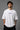 White POPCASE oversized tshirt with i'm not cristiano ronaldo but i also hate losing quote in navy on back, POPCASE Since 2022 tagline