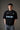 Black STAR BOY oversized t-shirt with a light blue raised graphic of a star and text. Detailed fabric texture shown. - black