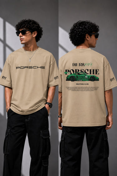 Beige oversized t-shirt featuring a vibrant green Porsche 911 RS RAWK graphic and 'Drifting Club' text. Mockup highlighting premium cotton fabric and stitching details.