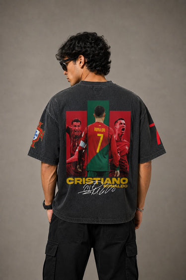 Model wearing a vintage wash dark blue oversized t-shirt with a graphic of Cristiano Ronaldo on the back and "CRISTIANO RONALDO" text on the front.