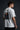 Model wearing white POPCASE Sir Lewis Hamilton oversized t shirt with Still We Rise 44 graphic and signature on chest