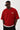 Man wearing a red Sumwon Club oversized t-shirt with white graphic print on front and back, styled for streetwear.