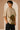 Unbroken Design oversized t-shirt in a beige hue featuring a detailed, stylized brown and green bull graphic print and "UNBROKEN" text across the chest. Showcases ribbed neckline.