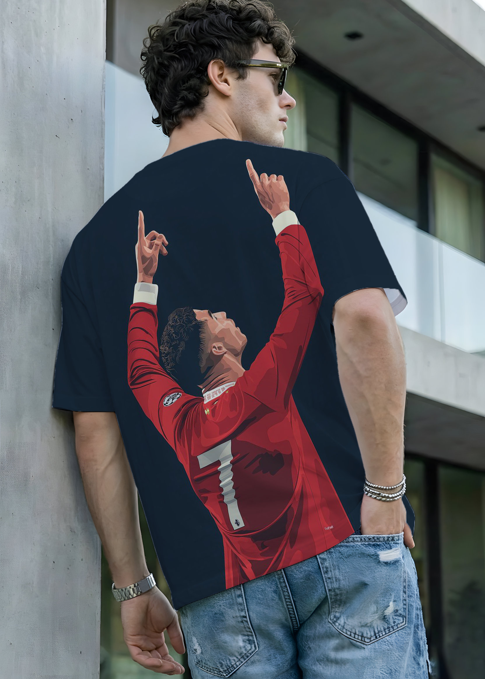 Person wearing a t-shirt with a graphic design of a person in a red jacket.