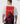 Person wearing a t-shirt with a graphic design and text on the back