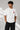 Man wearing a white oversized t-shirt with a large red Ace of Hearts graphic and 'pretty lucky' text on the back. Streetwear fashion. - white