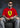 Person wearing a red shirt with a yellow logo sitting on a dark chair.