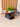 Toy car with remote control on a desk, featuring the brand 'deskco'.