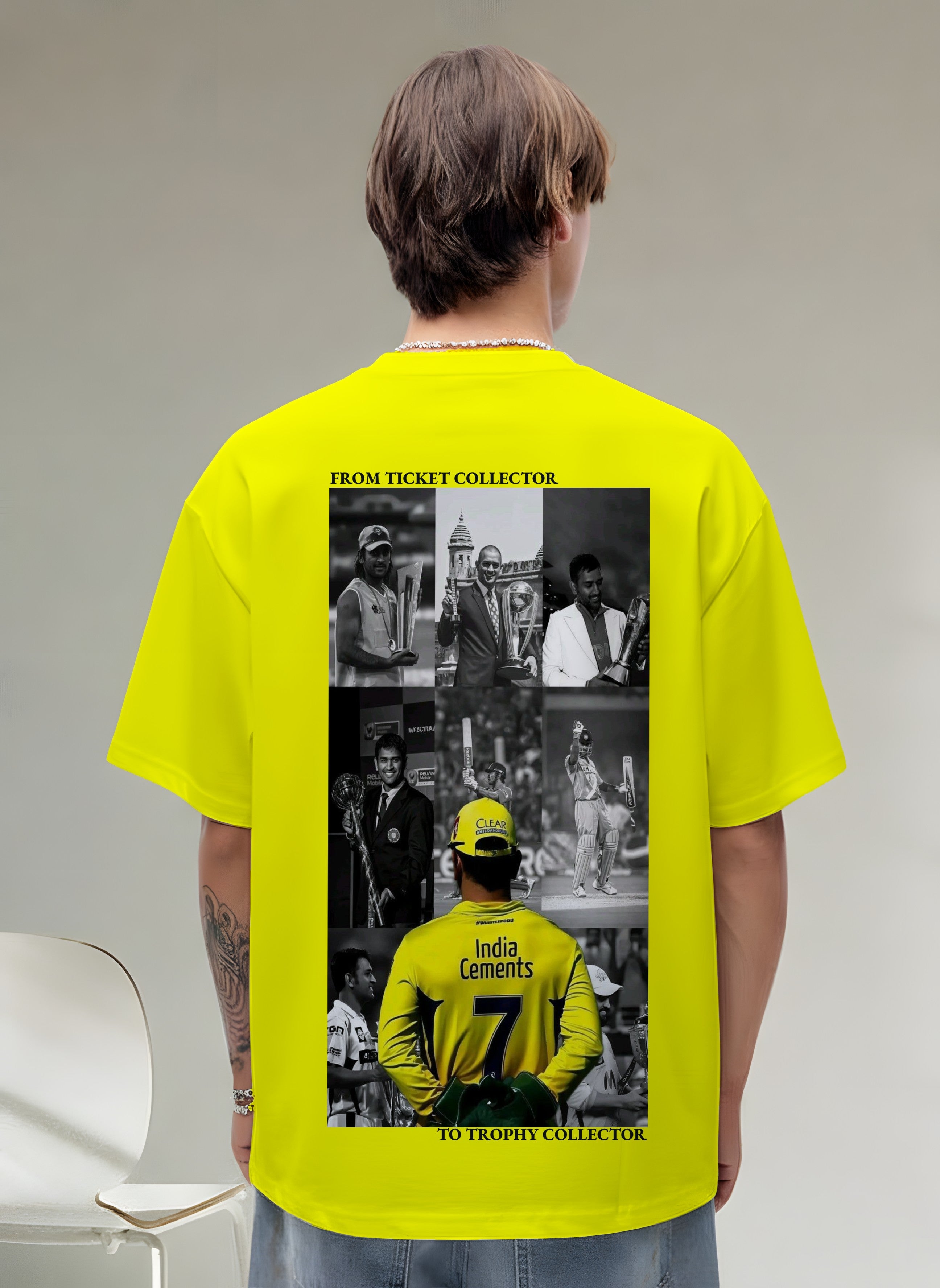 Person wearing MSD a bright yellow t-shirt with a graphic on the back, standing against a plain background.