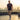 Man walking on a rooftop with a cityscape in the background
