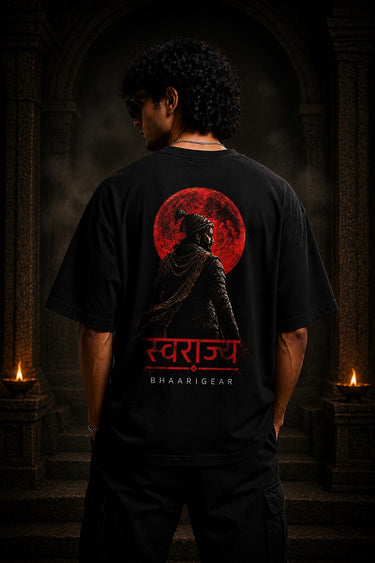 BHAARIGEAR Swaraj Shivaji oversized t-shirt in black, featuring a vibrant red graphic of Shivaji Maharaj against a blood moon. Designed for modern streetwear enthusiasts.