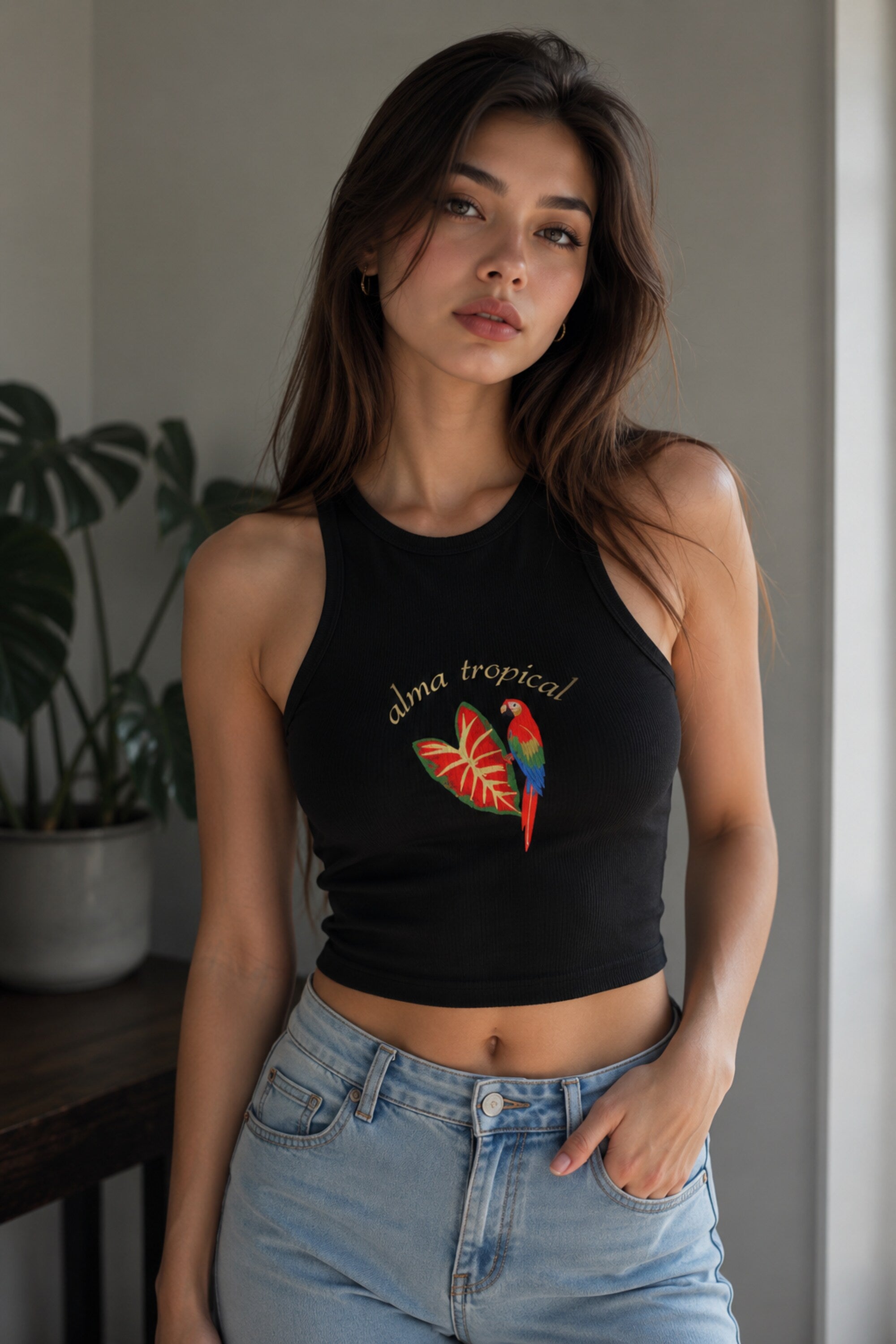 Black ribbed racerback crop tank top with alma tropical gold script and colorful macaw parrot tropical leaf graphic DTF print