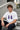 Model wearing white POPCASE Fernando Alonso oversized t shirt with navy blue crackled Have To Win 14 design and Alonso signature