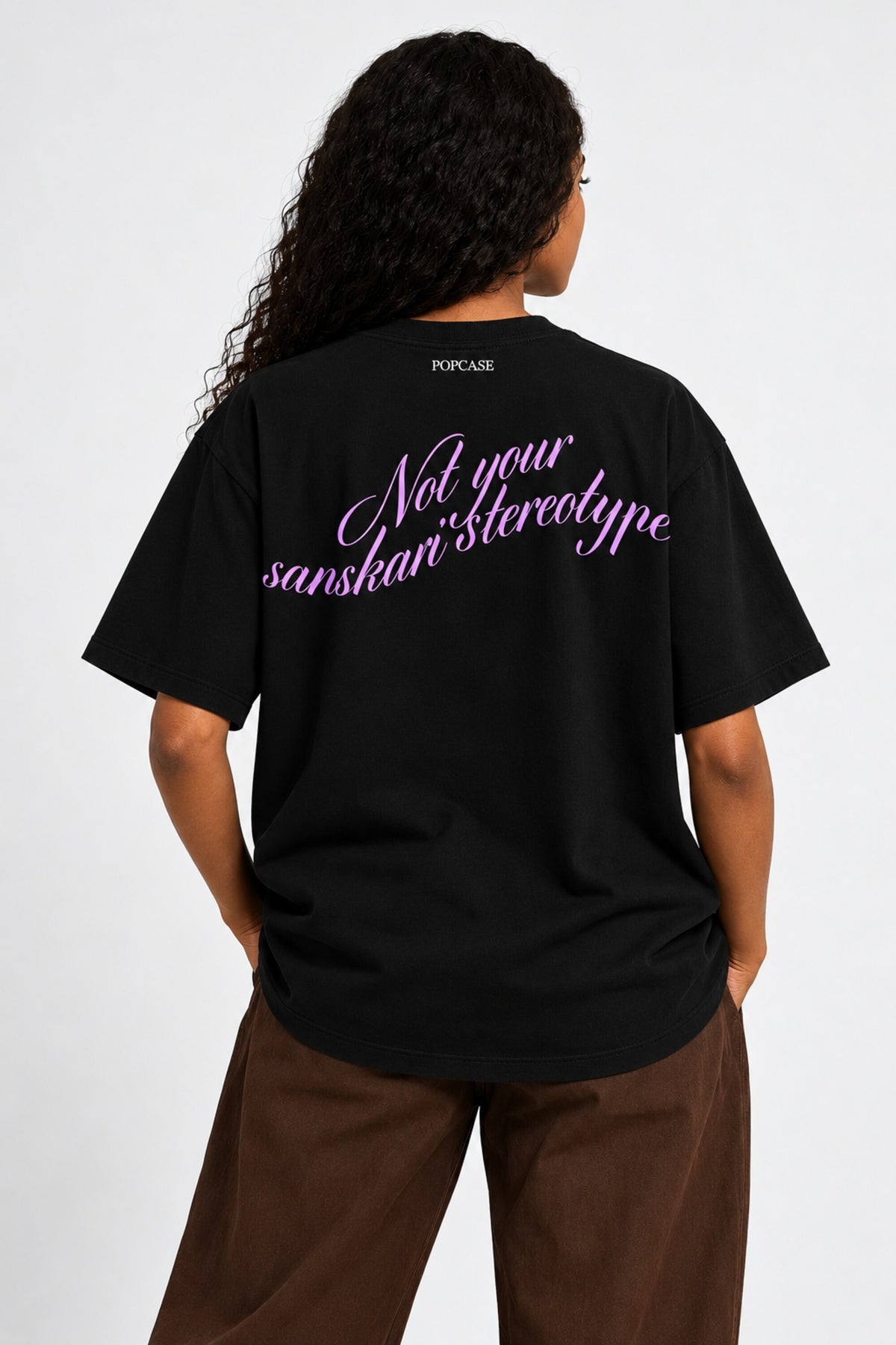 Black oversized tshirt with Baddie cursive script and purple-toned portrait photo print, drop shoulder boxy fit, India