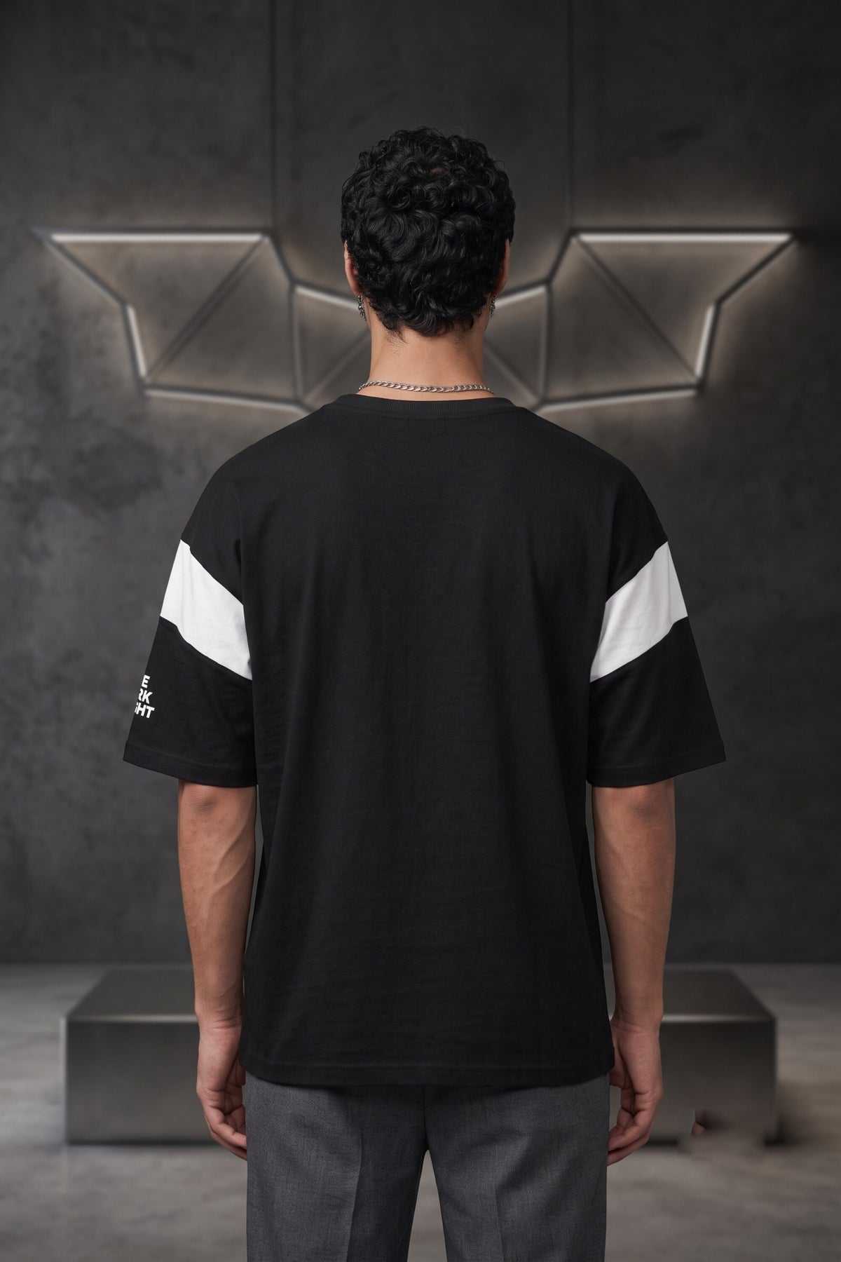 Black oversized tshirt with white Batman logo on chest and white wing panel sleeve details, drop shoulder boxy fit, men India