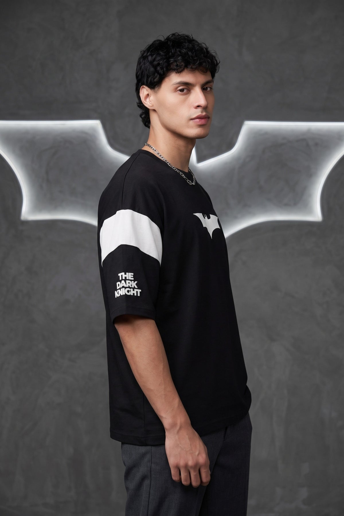 Black oversized tshirt with white Batman logo on chest and white wing panel sleeve details, drop shoulder boxy fit, men India