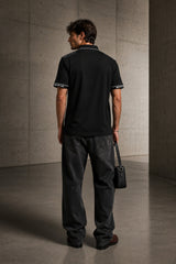 Black Mercedes-Benz AMG polo t-shirt with star logo, AMG branding and dark racing shoulder panel, motorsport India