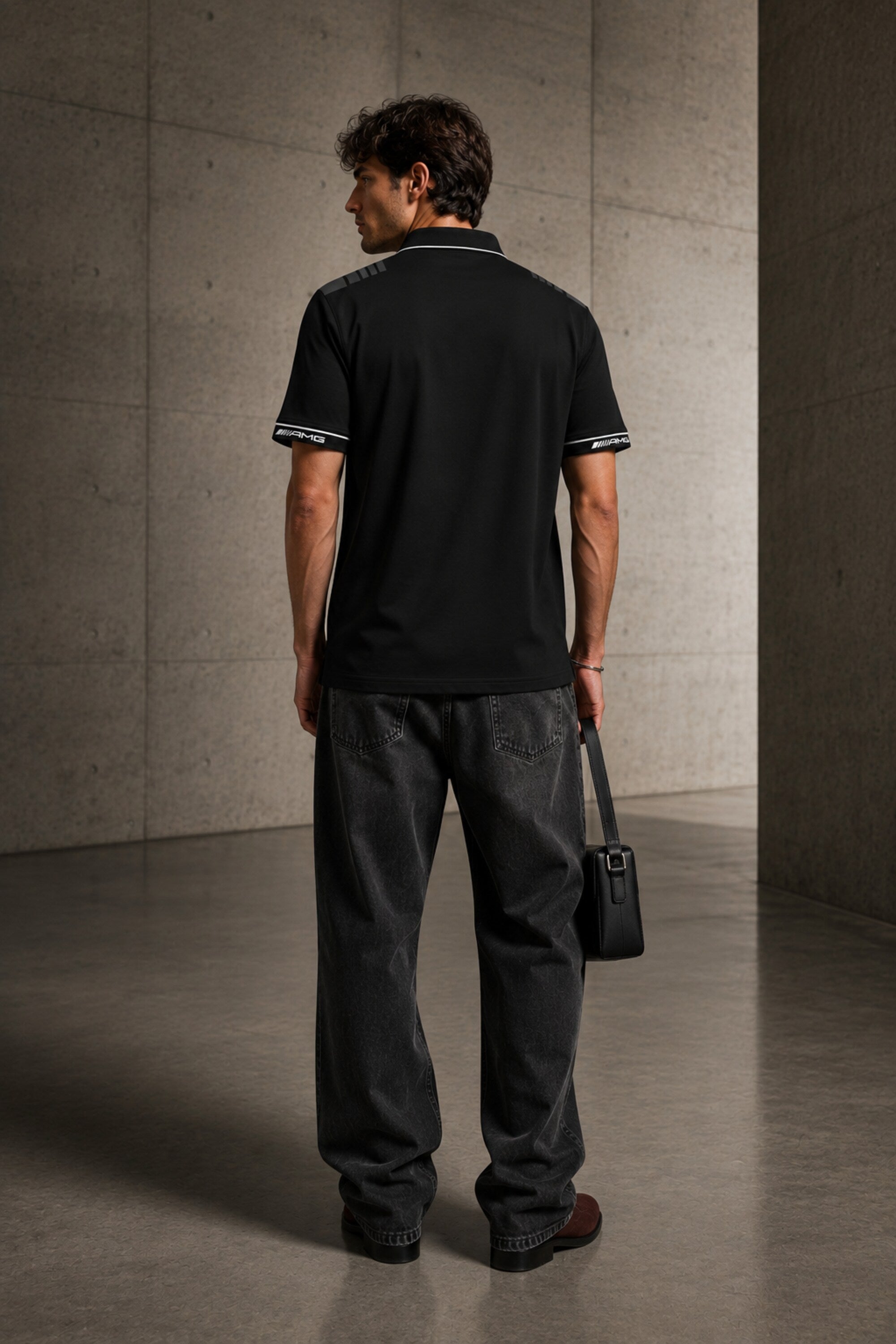 Black Mercedes-Benz AMG polo t-shirt with star logo, AMG branding and dark racing shoulder panel, motorsport India