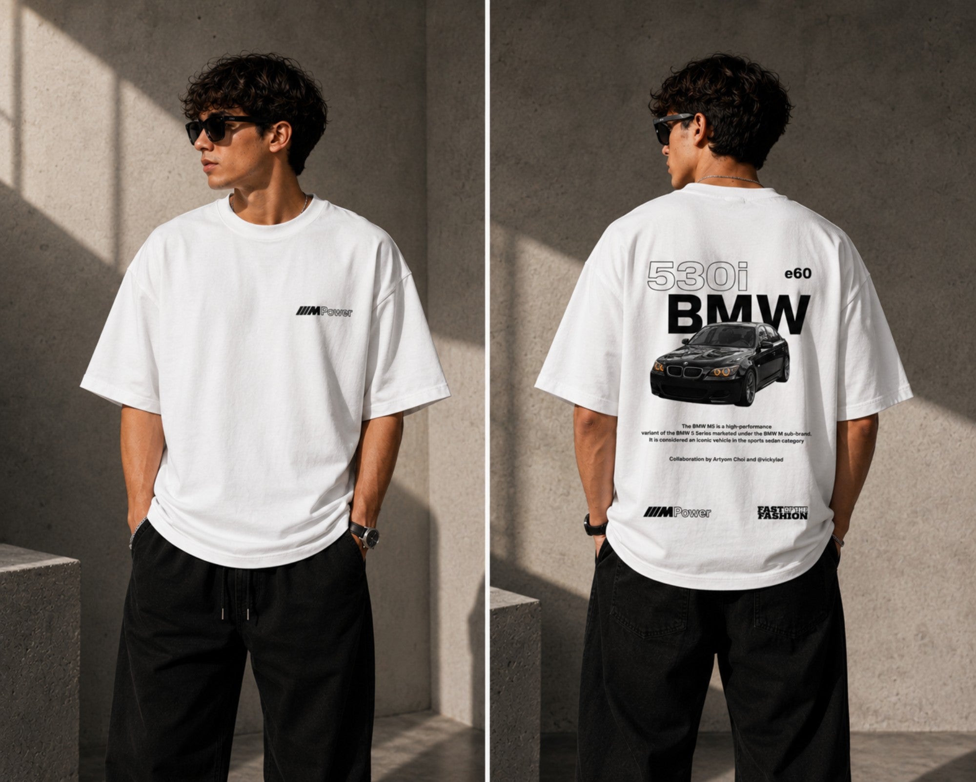 Man wearing a white oversized BMW M "530i E60" graphic t-shirt and black baggy jeans, standing against a textured concrete wall. - white