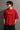 Red BIG BOY TOYZ x Hot Wheels oversized t-shirt featuring a vintage red Hot Wheels car graphic, checkered flag pattern, and brand logos. Showcase print quality and fabric.