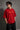Red BIG BOY TOYZ x Hot Wheels oversized t-shirt featuring a vintage red Hot Wheels car graphic, checkered flag pattern, and brand logos. Showcase print quality and fabric.