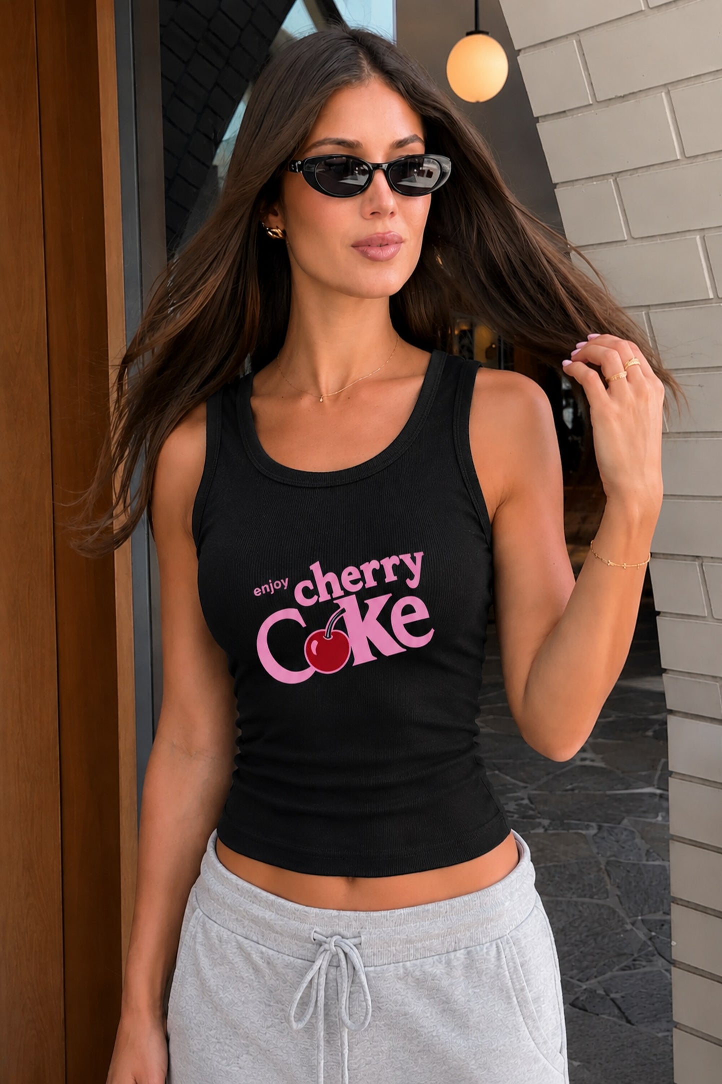 Black fitted ribbed racerback crop tank top Enjoy Cherry Coke vintage logo cherry graphic on back Y2K nostalgia aesthetic POPCASE women