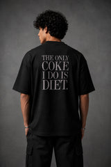 Black oversized t-shirt with hyper-realistic crushed Diet Coke can chest graphic
