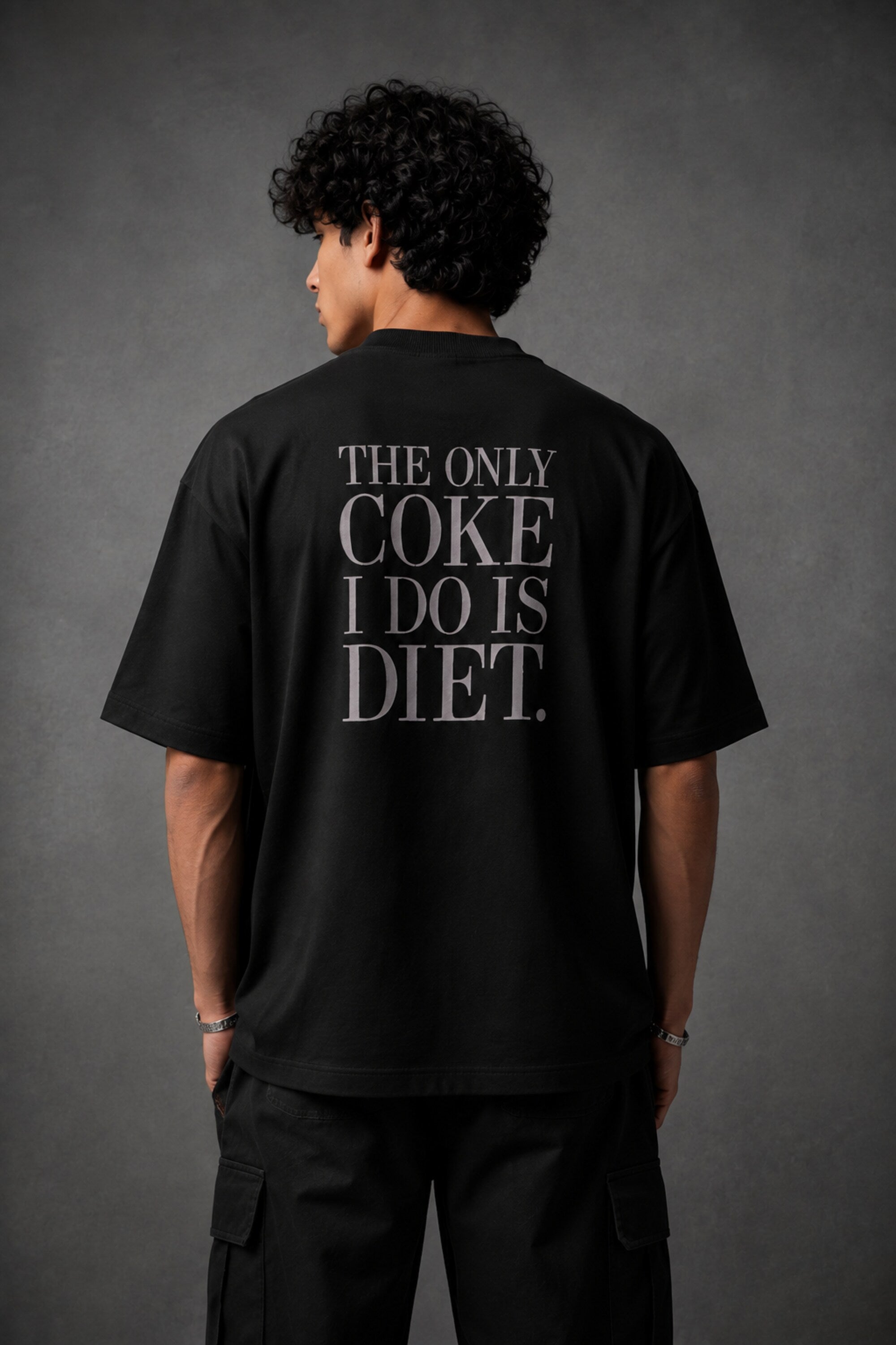 Black oversized t-shirt with hyper-realistic crushed Diet Coke can chest graphic