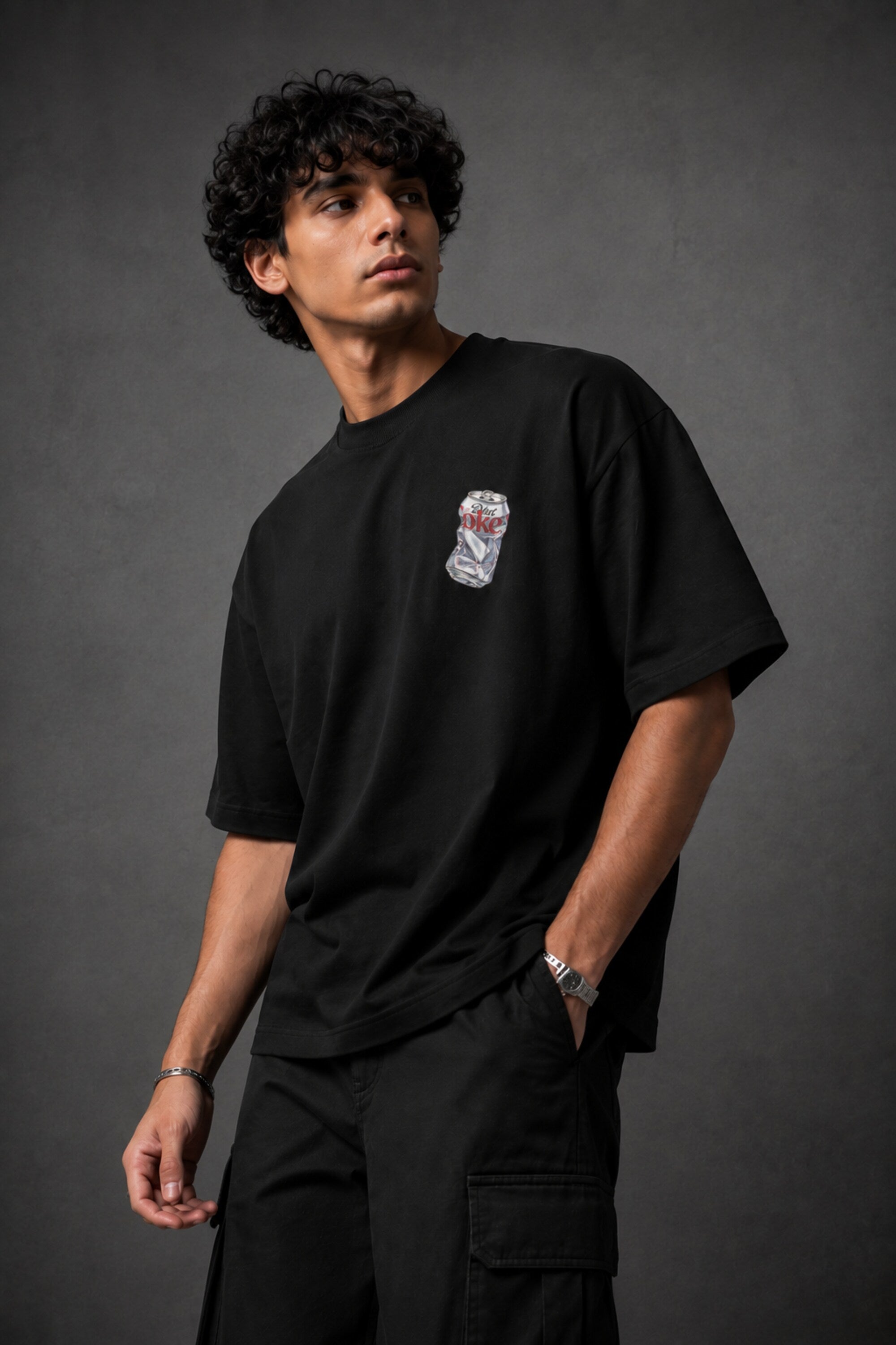 Black oversized t-shirt with hyper-realistic crushed Diet Coke can chest graphic