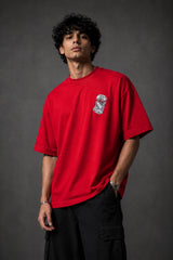 Black oversized t-shirt with hyper-realistic crushed Diet Coke can chest graphic - red