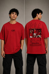 Man wearing a white CR7 oversized t-shirt with black CR7 logo. Studio shot with grey background.