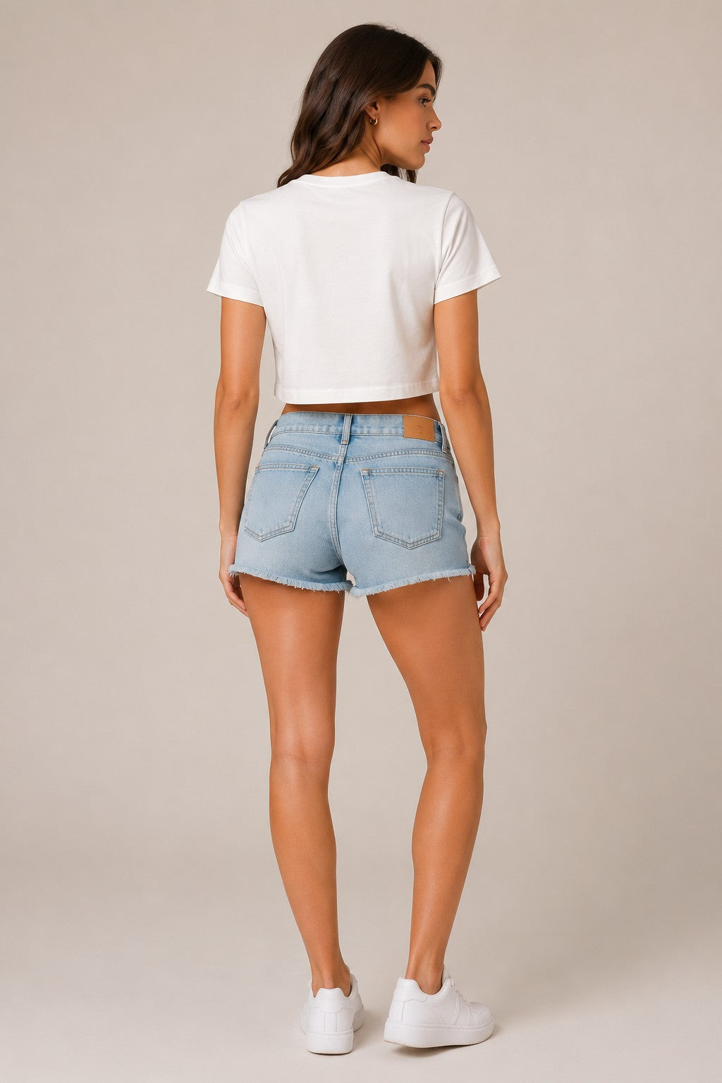 Model wearing a white "Sweet Heart" graphic oversized croptop t-shirt with red distressed lettering and star accents. Streetwear fashion.