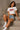 Model wearing a white "Sweet Heart" graphic oversized croptop t-shirt with red distressed lettering and star accents. Streetwear fashion.